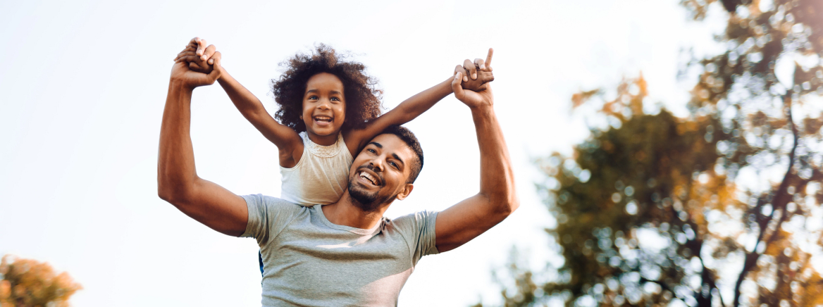 Happy father and child spending time outdoors and laughing