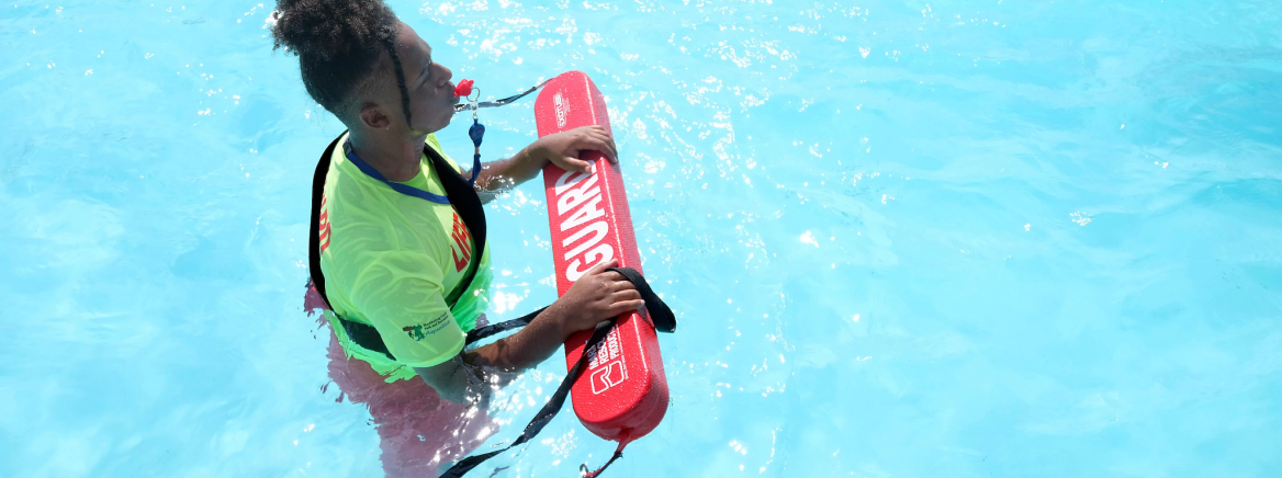 Lifeguard in pool Double Oaks Pool a few weeks after opening