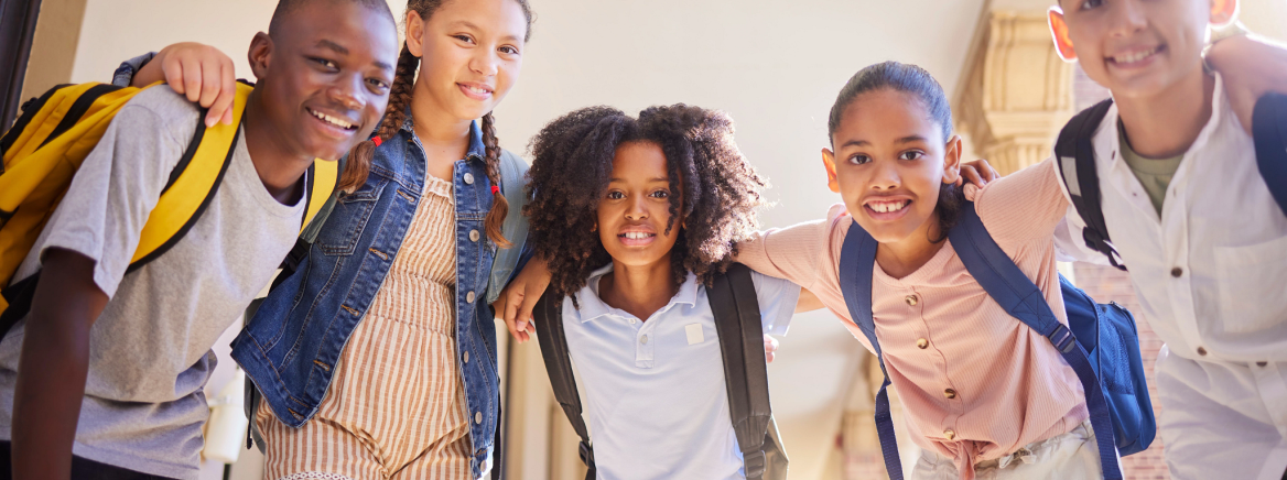 School friends A diverse group of school friends wearing backpacks and smiling