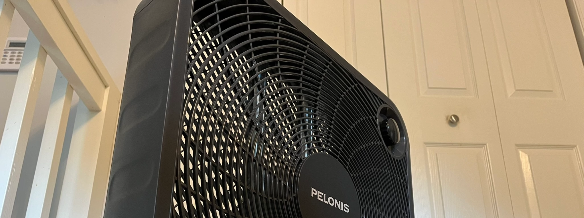 A box fan with a door in the background.