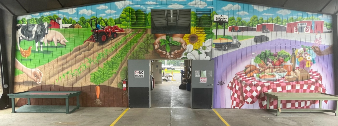 A vibrant mural at the Charlotte Regional Farmers Market, showcasing the importance of food security, healthy eating, and the vital connections between farmers and the community.